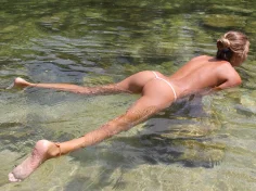 By the water